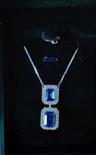 3-00-carat-emerald-royal-blue-sapphire-halo-pendant-with-chain-in-18k-white-gold